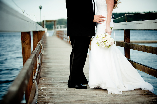 white mermaid style wedding dress - waterfront bride and groom portrait - real wedding photo by Seattle photographer Laurel McConnell